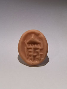 Seal-amulet in form of a lying ram - Black serpentine and agate