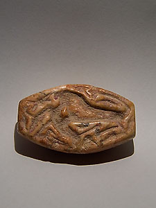 Sumerian seal depicting a lion crushing a gazelle - Pink marble