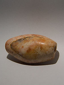 Sumerian seal depicting a lion crushing a gazelle - Pink marble