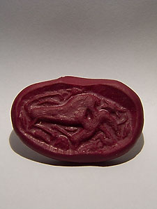 Sumerian seal depicting a lion crushing a gazelle - Pink marble