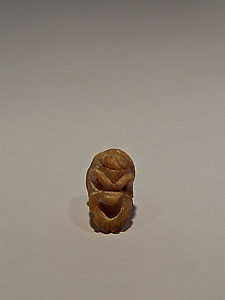 Small button in the form of mask of theater - Coral