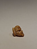 Petit bouton en forme de masque de théâtre - Corail